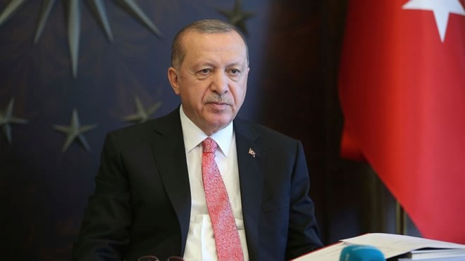 Turkish President Recep Tayyip Erdogan, listens during a teleconference with his cabinet in Istanbul, Monday, May 11, 2020. Erdogan announced a new four-day curfew to stem infections, that includes the weekend and a public holiday on May 19. The country has opted to impose short weekend curfews, instead of full lockdowns, fearing their possible negative effects on the already troubled economy.(Presidential Press Service via AP, Pool)