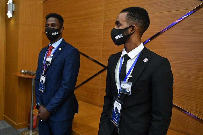 Ushers welcome guests at the launch of the VISA card service by the International Bank of Somalia (IBS) in Mogadishu, Somalia. The service launched on Wednesday 7 July 2021, marks a significant milestone for Somalia’s re-emerging financial sector. AMISOM photo / Fardowsa Hussein