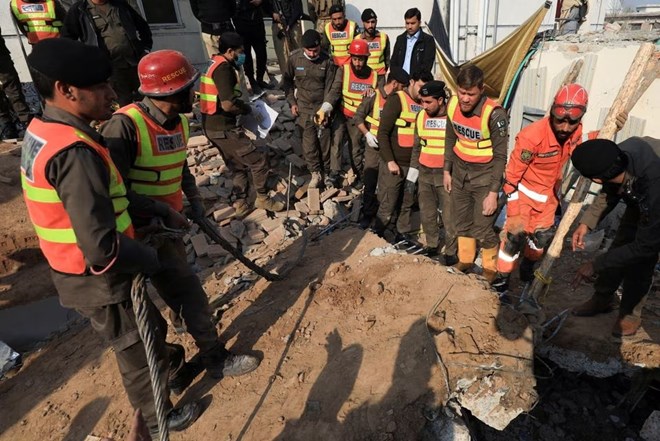 Rescue workers clear the rubble as they search for victims, after a suicide blast in a mosque in Peshawar, Pakistan January 31, 2023. REUTERS/Fayaz Aziz